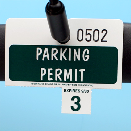 Kwik Detachable Hang Tag on rear view mirror w/ bottom perforated tabs detached Kwik Detachable Hang Tag on rear view mirror w/ bottom perforated tabs detached